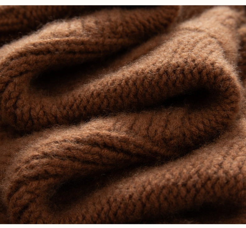 Close-up of soft, luxurious brown fabric showcasing a luxury cashmere sweater for women