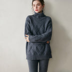Cozy gray luxury cashmere sweater for women with a high neckline and cable knit design