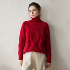 Elegant red luxury cashmere sweater for women featuring a high neck and ribbed design