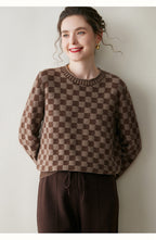 Luxury women's knit sweater in brown checkered pattern, perfect for stylish comfort in cool weather