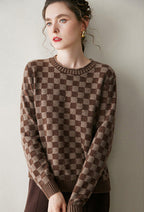 Luxury women's knit sweater in a brown checkered pattern, perfect for stylish layering in cool weather.