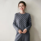Luxury women's knit sweater in gray with a checkerboard pattern, perfect for stylish warmth