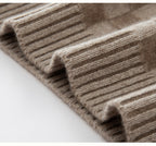 Luxury women's knit sweater in a soft beige color featuring a ribbed texture for comfort and style