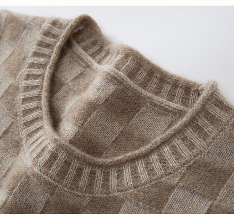 Close-up of a beige luxury women's knit sweater showcasing a soft texture and classic ribbed neckline