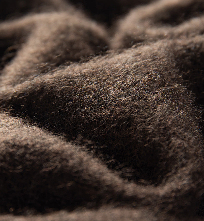 Close up texture of thick cashmere fabric showcasing soft fibers of the Maison Eline Essential Cashmere Jacquard Sweater Thickened Luxury with Timeless Animal Motif