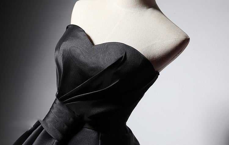 Elegant Maison Noir Strapless Dress featuring a flattering silhouette and stylish bow detail