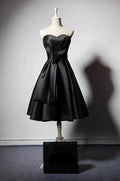 Elegant Maison Noir Strapless Dress in Black with a Flared Skirt and Timeless Design