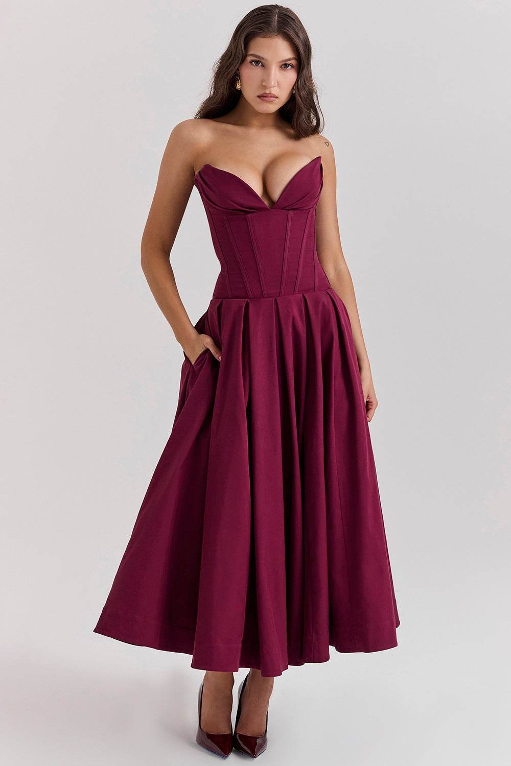 Elegant burgundy maxi dress with deep neckline and flattering A-line silhouette