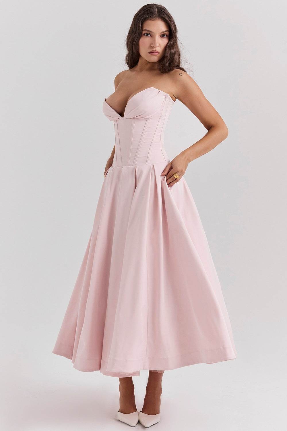 Elegant pink maxi dress with deep neckline and fitted bodice for special occasions