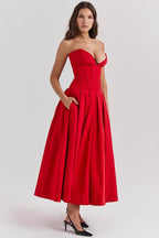 Elegant red AM Vision RO maxi dress with deep neckline and flared skirt for special occasions