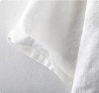Close-up of a white Men's Linen Shirt showcasing soft fabric and detailed stitching