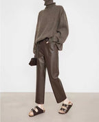 Stylish outfit featuring Merard Luxe Sheepskin Pants paired with a cozy sweater and casual sandals