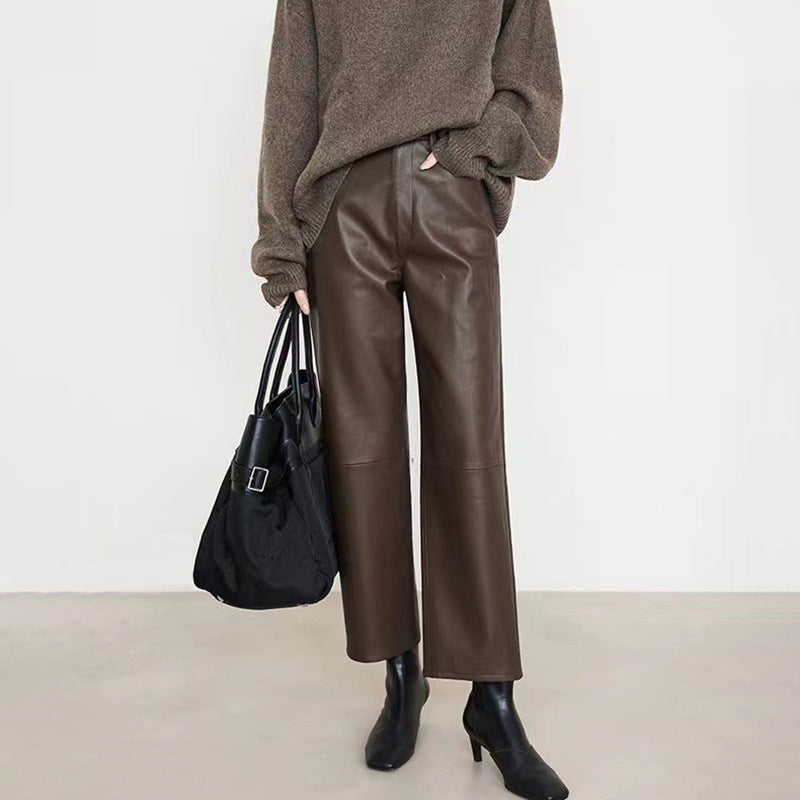 Stylish Merard Luxe Sheepskin Pants in rich brown, paired with a cozy sweater and handbag