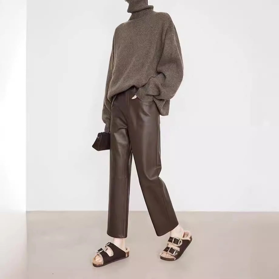 Model wearing Merard Luxe Sheepskin Pants styled with a cozy sweater and chic sandals