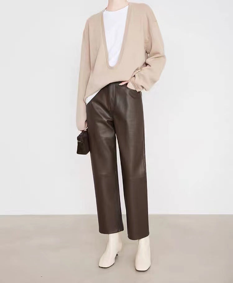 Woman wearing Merard Luxe Sheepskin Pants paired with a beige sweater and white top