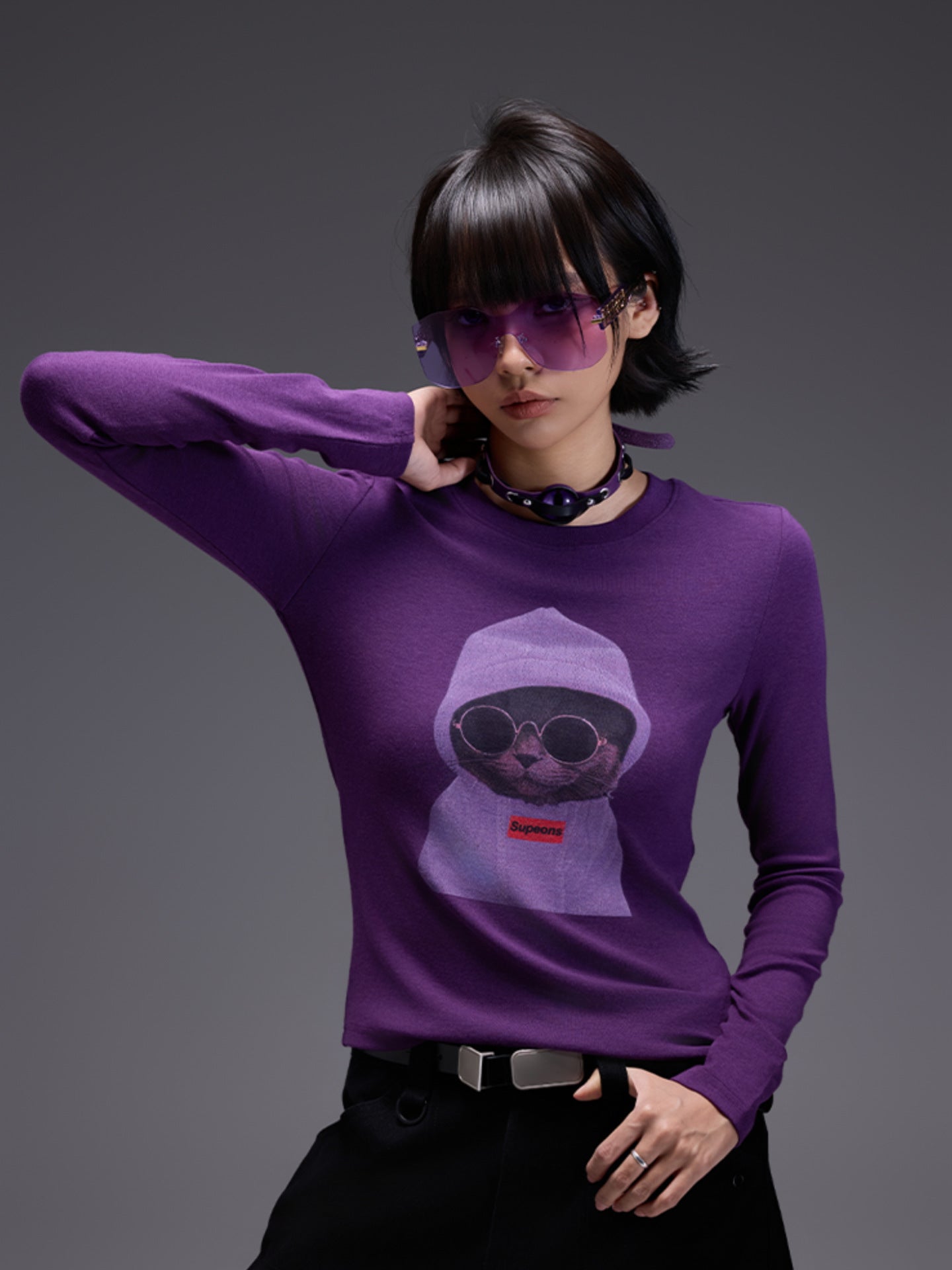 Stylish model wearing a purple Midnight Cat Stretch Tee featuring a cool cat graphic and sunglasses