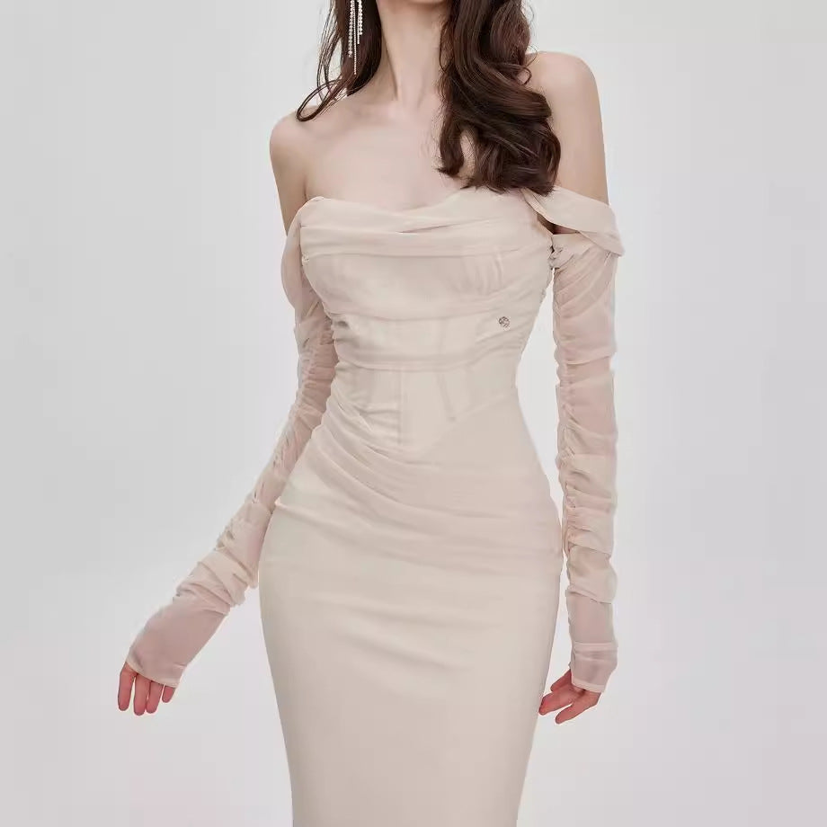 Midnight Muse Off-Shoulder Fishtail Dress in light beige with elegant long sleeves and fitted silhouette