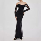 Midnight Muse Off-Shoulder Fishtail Dress in black with sheer long sleeves and fitted silhouette