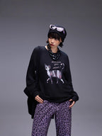 Model wearing Midnight Paws Street Top featuring a playful cat graphic and relaxed fit