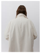Back view of a Milk Tea Reversible Luxe Fur Trench showcasing its stylish and cozy design