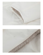 Soft and luxurious fabric of the Milk Tea Reversible Luxe Fur Trench showcasing high-quality stitching details