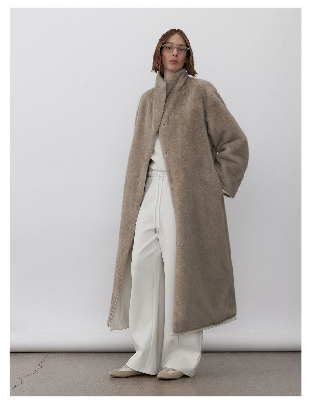 Milk Tea Reversible Luxe Fur Trench Coat in soft beige with a comfortable fit for stylish layering