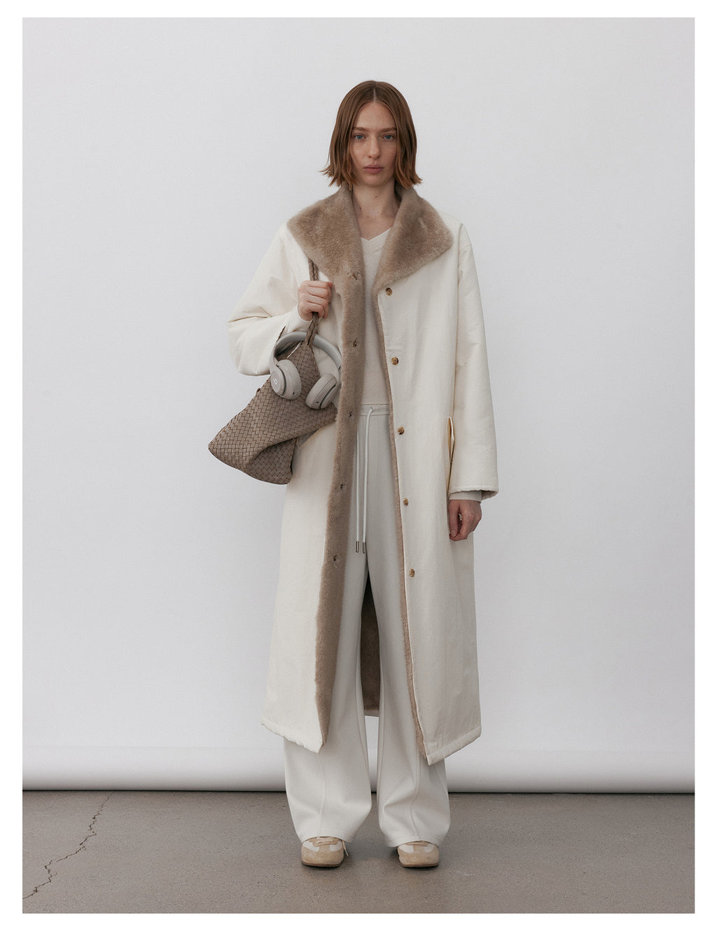 Milk Tea Reversible Luxe Fur Trench Coat featuring a cozy design and stylish collar for a chic look