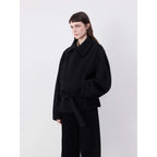 AM Vision RO Minimalist Belted Short Coat in black with a button front and relaxed fit