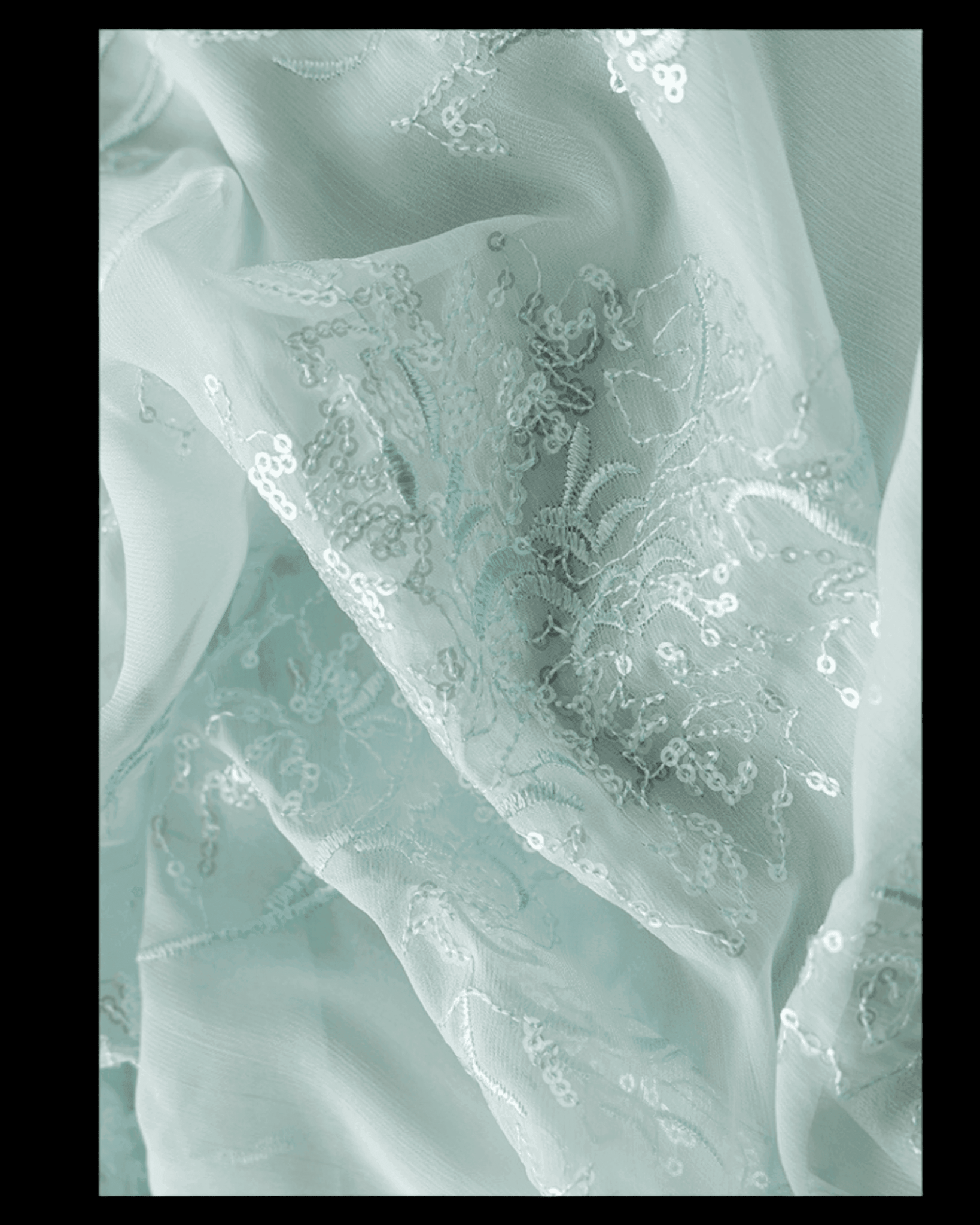 Close-up of soft fabric showcasing a Mint Blue Dress with Embroidery details