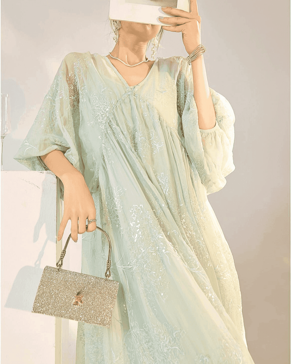 Elegant Mint Blue Dress with Embroidery featuring a flowy silhouette and billowy sleeves
