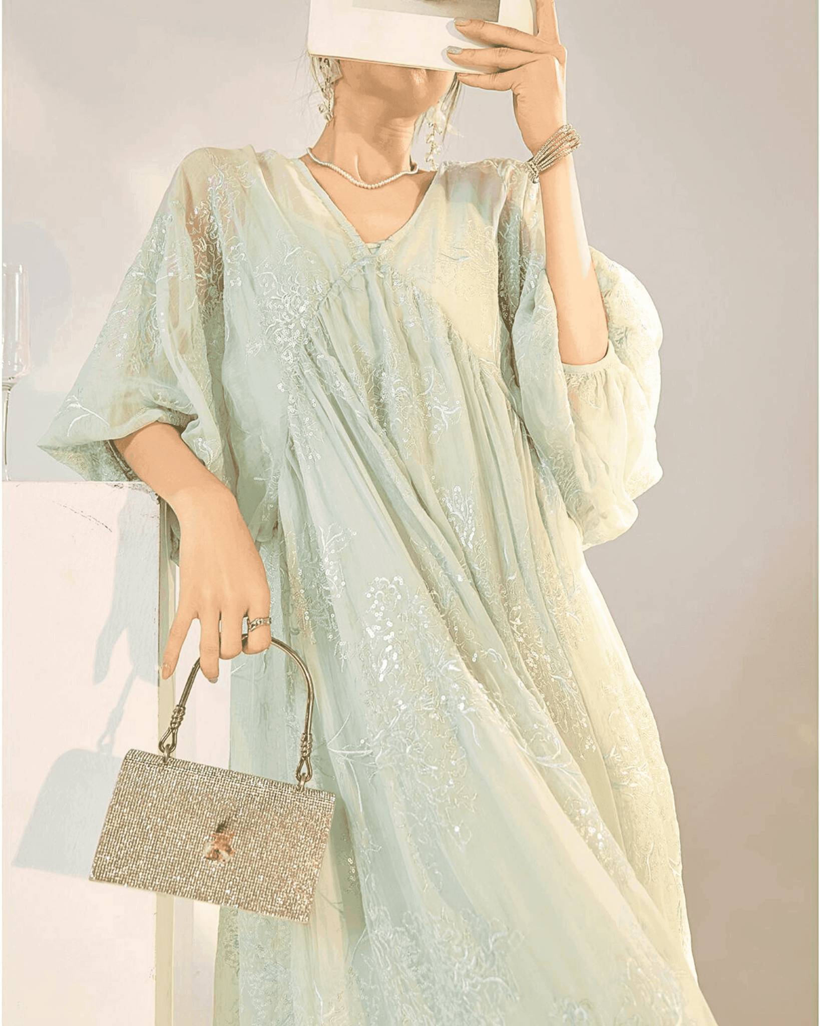 Elegant Mint Blue Dress with Embroidery featuring a flowy silhouette and billowy sleeves