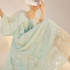 Mint Blue Dress with Embroidery featuring a flowy design and floral patterns for an elegant look