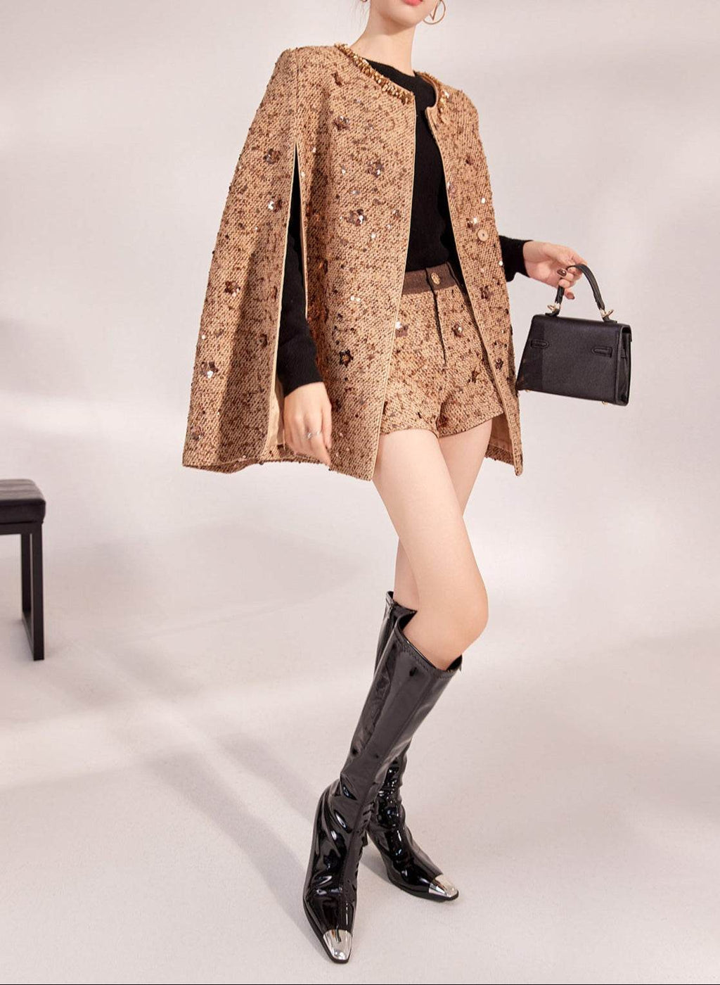 Stylish Mocha Mousse Cape Jacket with sequins, paired with shorts and knee-high boots for a chic look