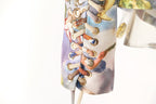 Detail of Mocha Mousse Cape Jacket showcasing intricate lacing and vibrant fabric patterns