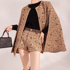 Mocha Mousse Cape Jacket crafted in textured fabric, paired with stylish shorts and a chic handbag