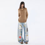Moomins Cartoon Jeans in Light Blue with Colorful Illustrations of Moomin Characters