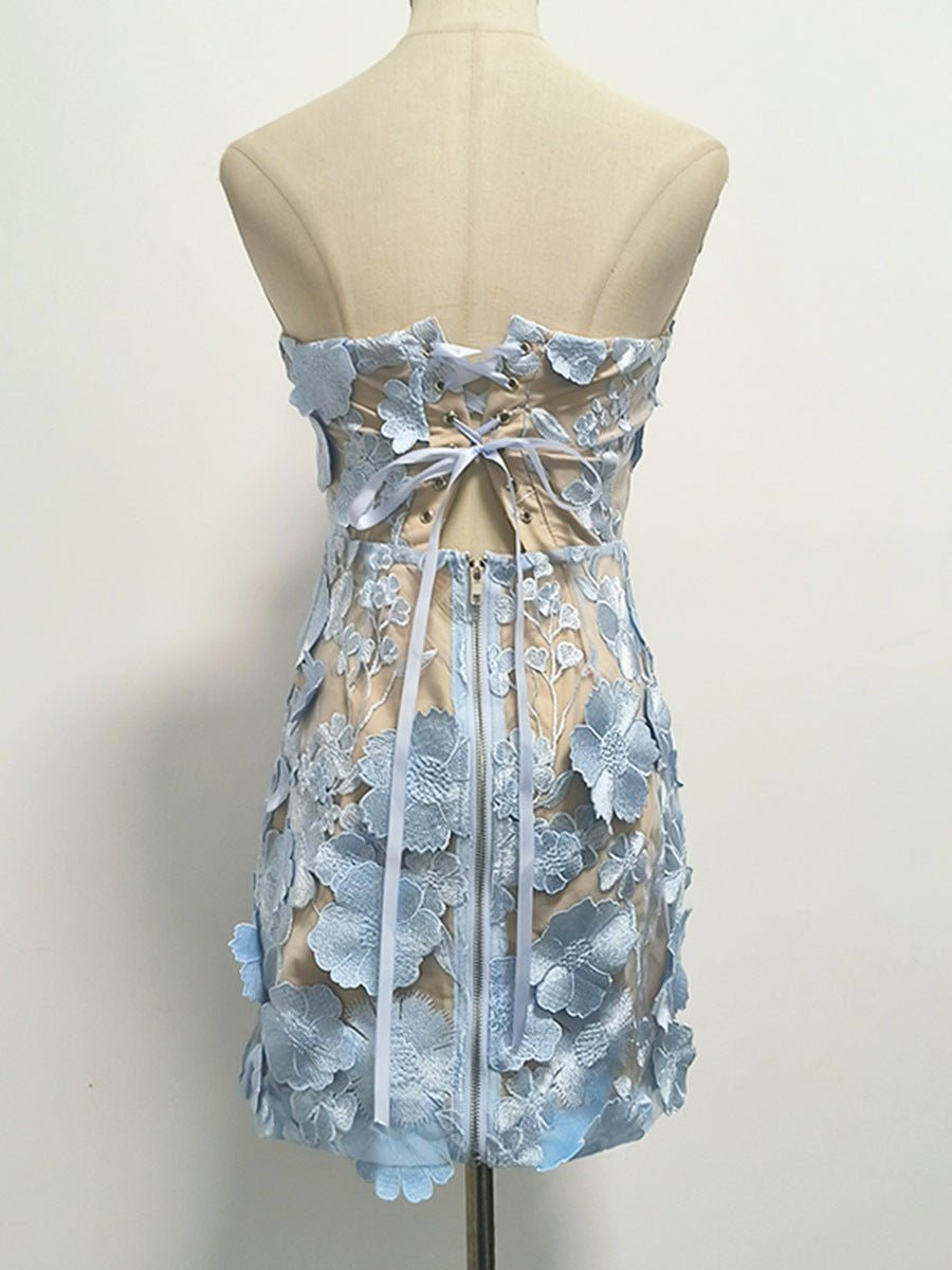 Back view of the AM Vision RO Naked Illusion Dress With Embroidered Flowers in light blue with floral details