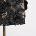 Close-up of the Naked Illusion Dress With Embroidered Flowers showcasing intricate black floral details