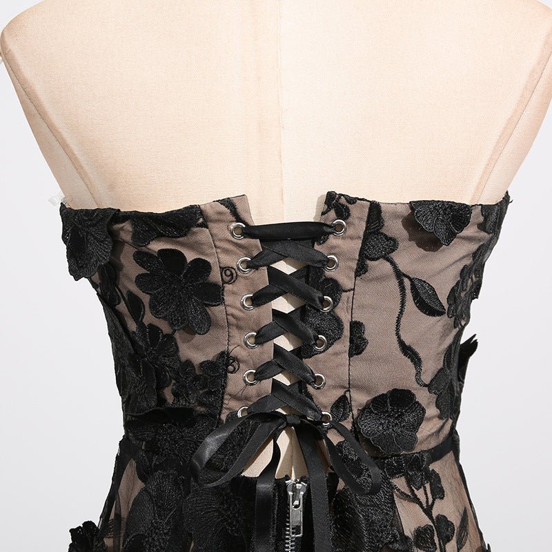 Back view of the Naked Illusion Dress With Embroidered Flowers featuring lace-up design and floral embroidery.