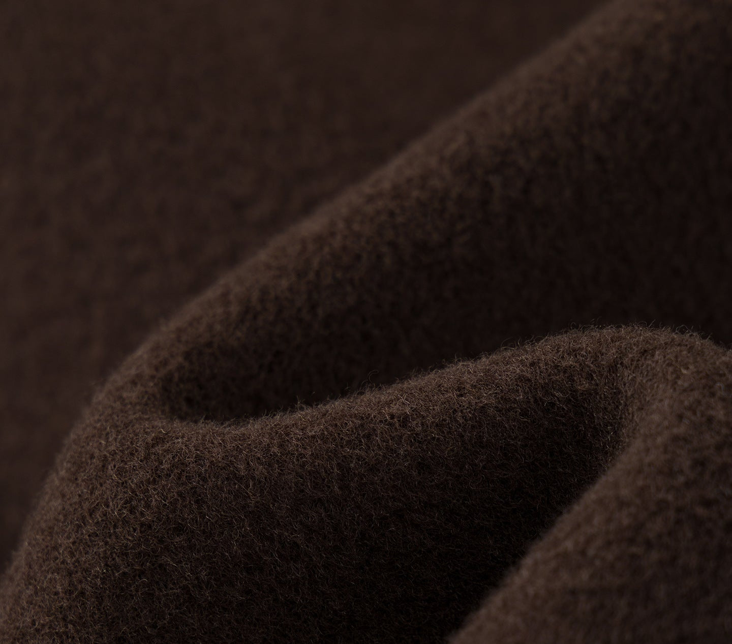Close-up of soft brown fabric showcasing the texture of Nara Wool X Cashmere Hooded Coat