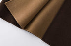 Close-up of luxurious fabric showcasing Nara Wool X Cashmere Hooded Coat in rich brown and tan hues