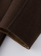 Close-up of the Nara Wool X Cashmere Hooded Coat in rich brown showcasing soft texture and quality fabric