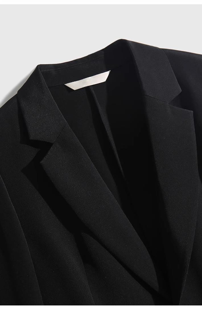 Close-up of a stylish black Natural Silk Blazer with a classic lapel design