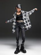 Model wearing Night Rider Painted Skinny Jeans paired with a plaid shirt and black boots for a stylish look