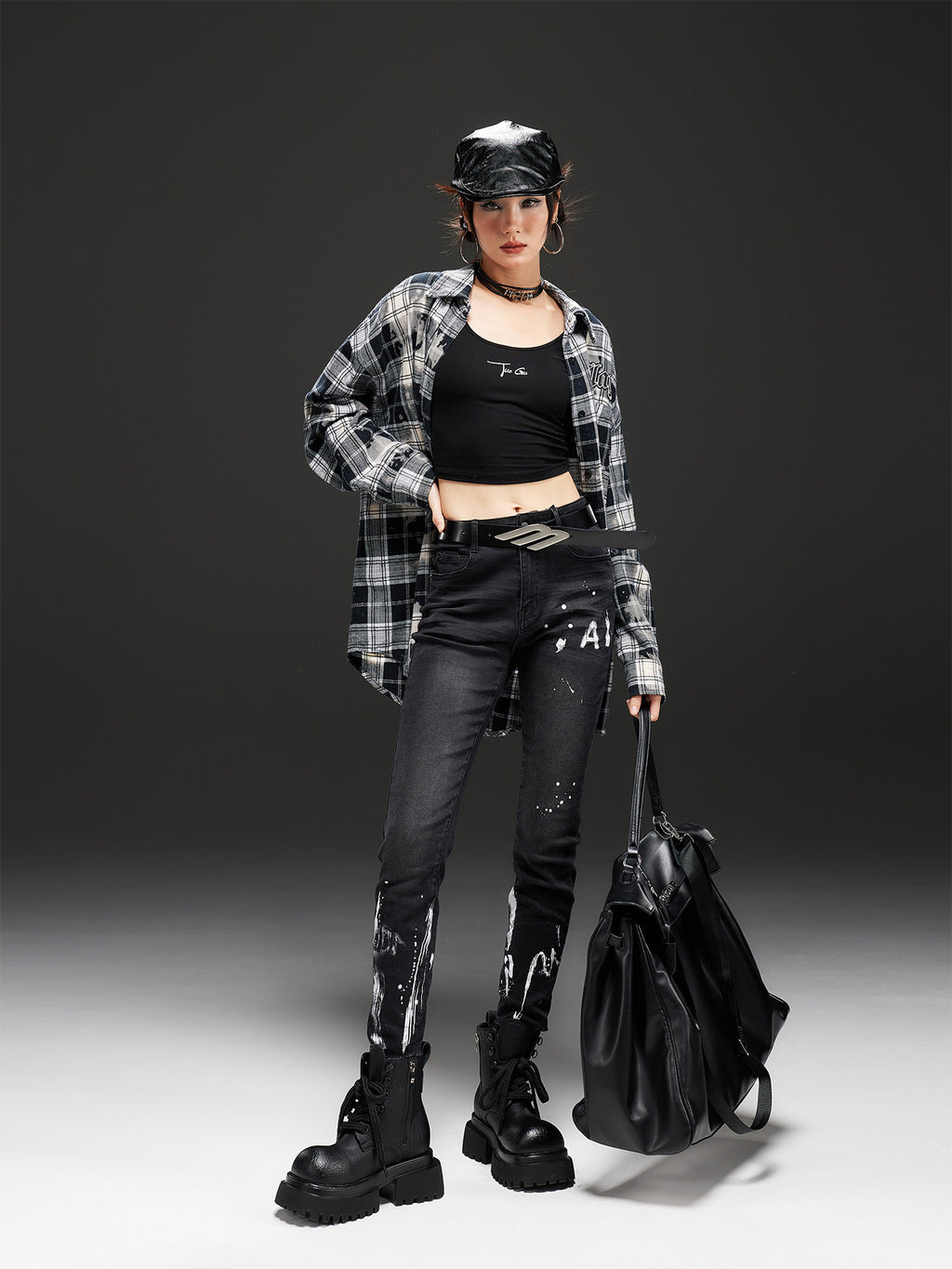 Model wearing AM Vision RO Night Rider Painted Skinny Jeans paired with a plaid shirt and black boots