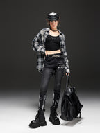 Model wearing AM Vision RO Night Rider Painted Skinny Jeans paired with a plaid shirt and black boots