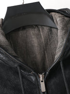 Close-up of the interior of a Noir Atlas Hooded Goatskin Jacket featuring soft lining and hood detail