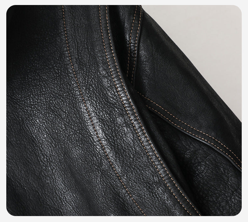 Close-up view of the Noir Atlas Hooded Goatskin Jacket showcasing the texture and stitching details