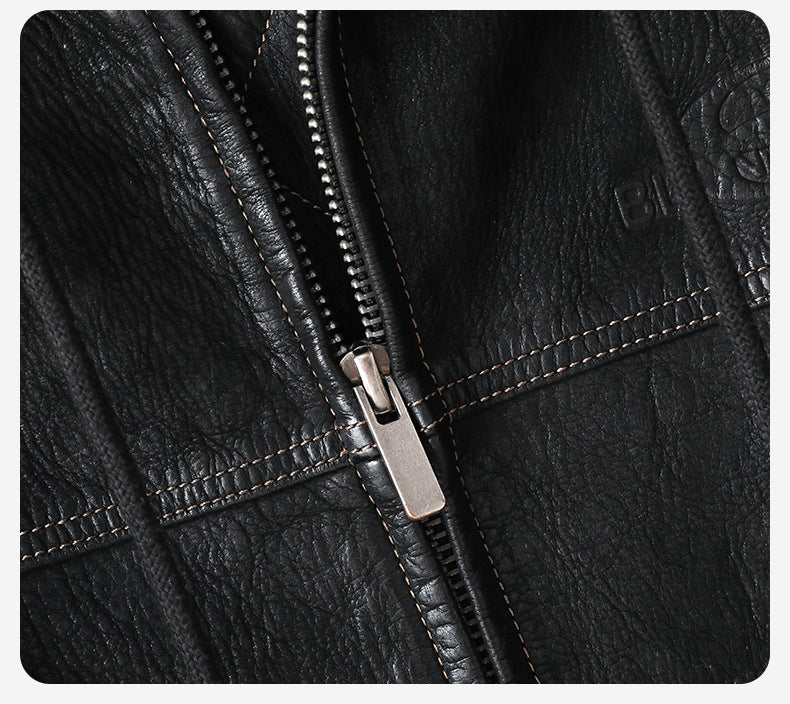 Close-up of the zipper detail on a Noir Atlas Hooded Goatskin Jacket with contrasting stitching
