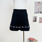 AM Vision RO Nordic Echo Knit Set featuring a cozy black skirt with a decorative pattern